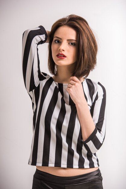 Young beauty woman in black-white shirt looking