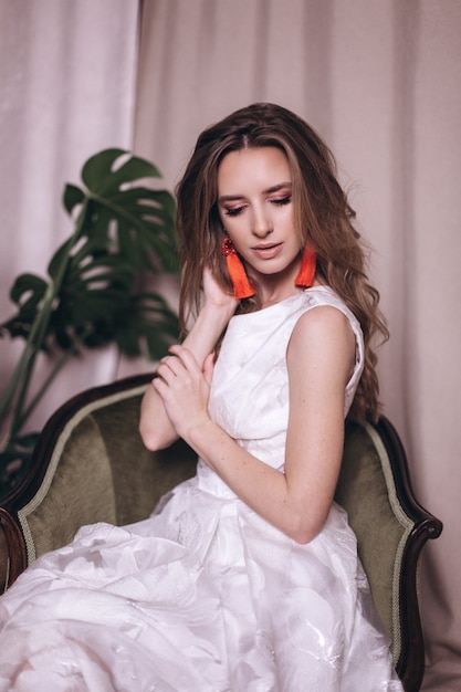 Young beauty woman portrait in white dress. Wedding, ellegance, fashion concept