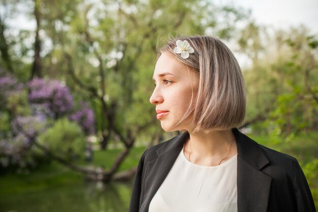 Young beauty woman in spring park