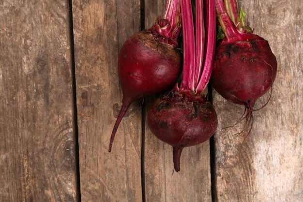 Young beets on wooden table