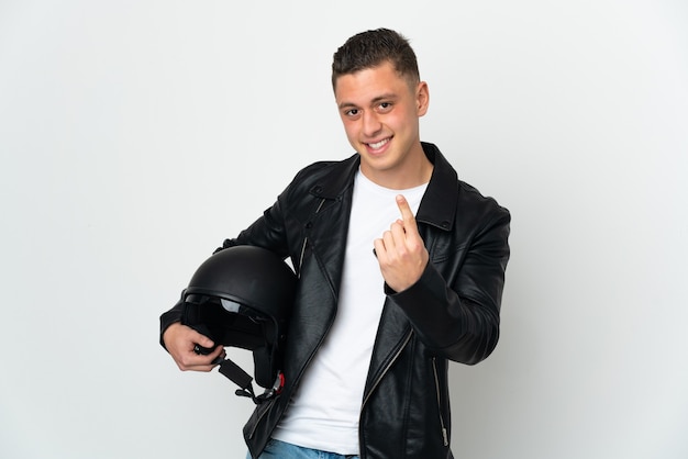 Young biker holding a motorcycle helmet