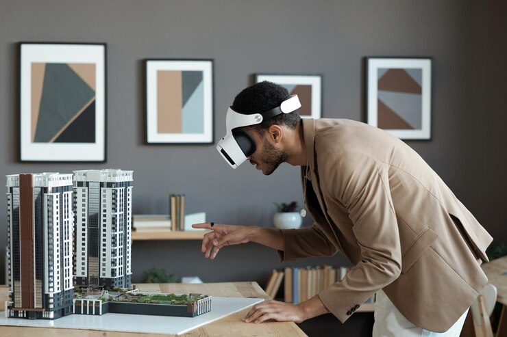 Photo young biracial businessman bending over table and pointing at house layout