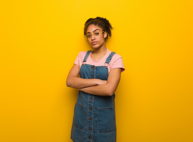 Young black african american girl with blue eyes looking straight ahead