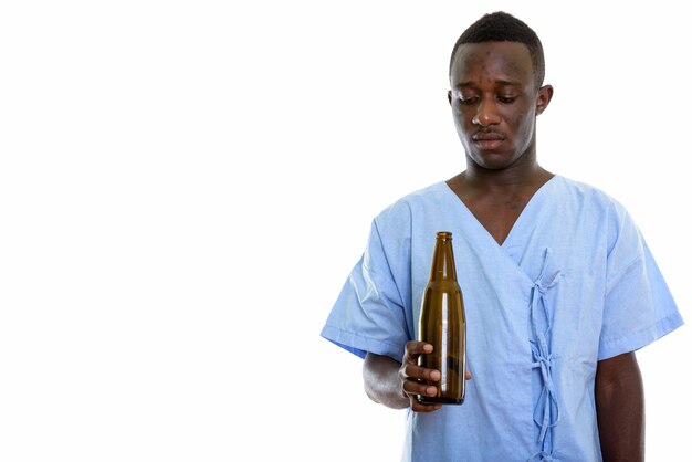 young black African man patient holding a beer