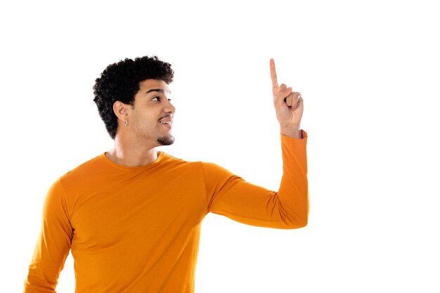 Young black afro guy laughing and pointing to something with his finger isolated  