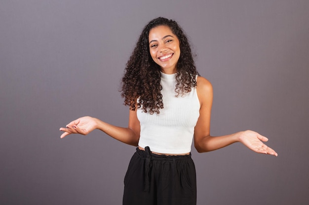 Young black Brazilian woman With open arms welcome