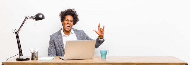 Young black businessman feeling happy