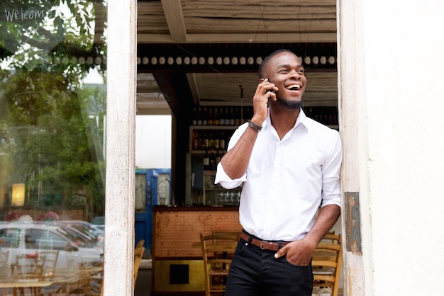 Young black businessman talking on mobile phone 