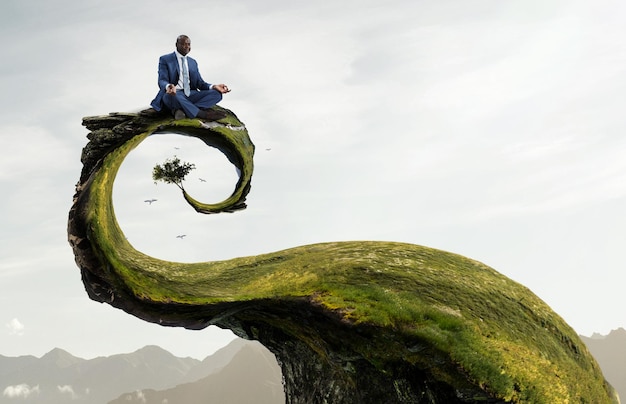 Young black man sitting and meditating. Mixed media