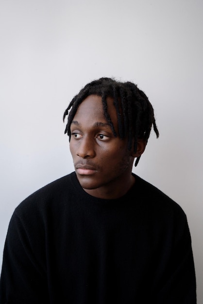 Young black man wearing jumper studio portrait