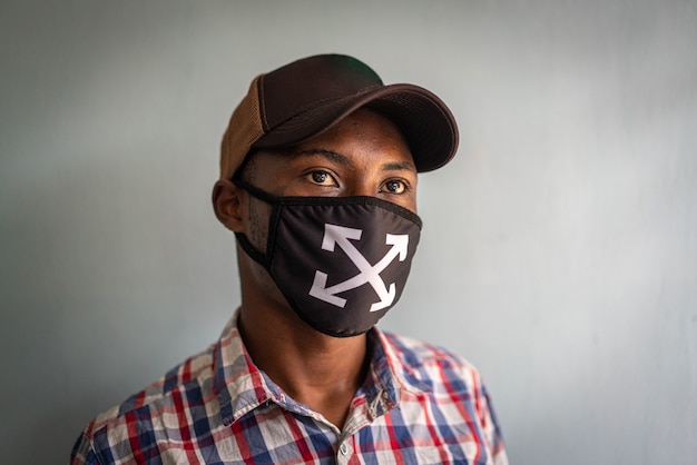 Young black man wearing mask on face