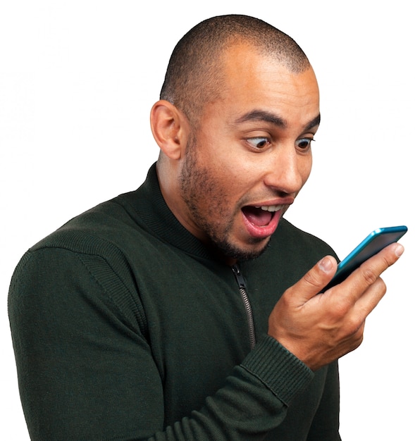 Young and black man yelling at the cellphone