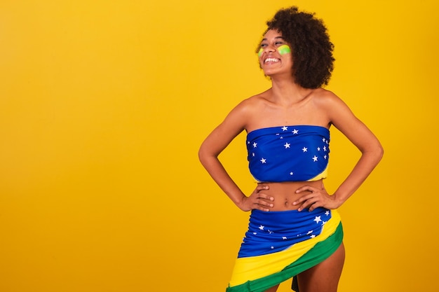 Young black woman brazilian soccer fan hands on waist