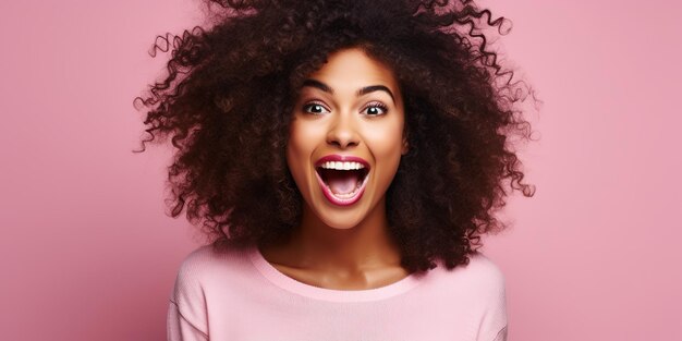 Young black woman feeling excited shouting OMG or WOW expressing emotions of joy