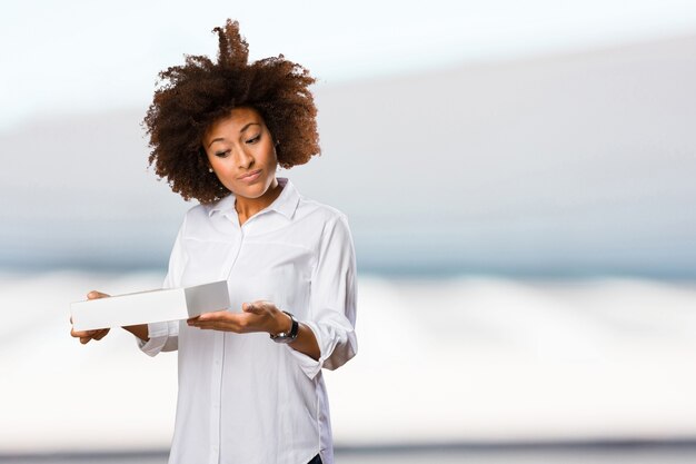 young black woman holding a white box