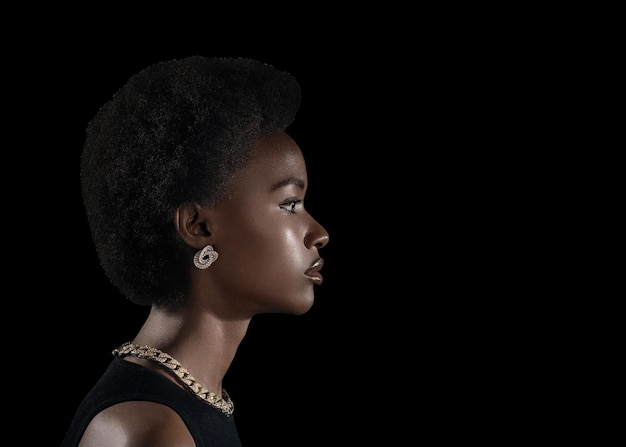 Young black woman profile beauty portrait on dark background