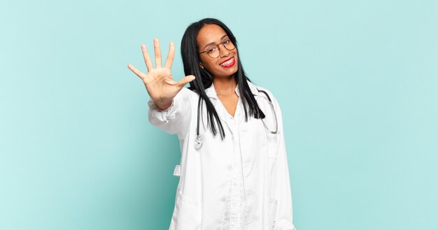 Young black woman smiling and looking friendly