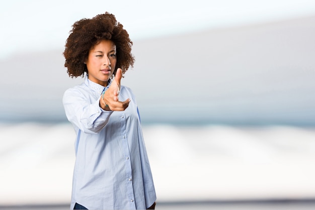 young black woman touching screen