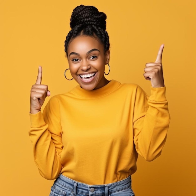 young black woman with braids wearing casual clothes pointing thumb up to the side smiling happy