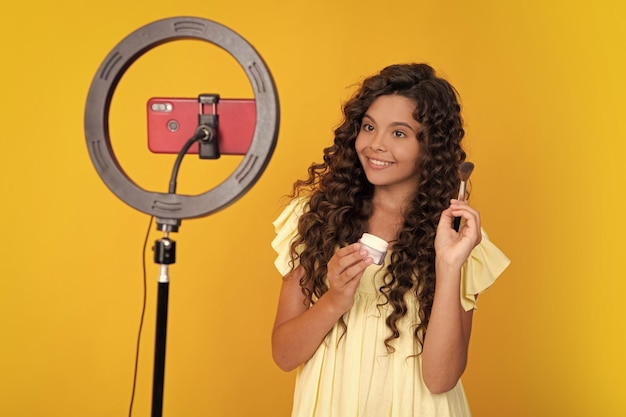Young blogger child recording video for blog Teen girl speaking in front camera for vlog Teenager