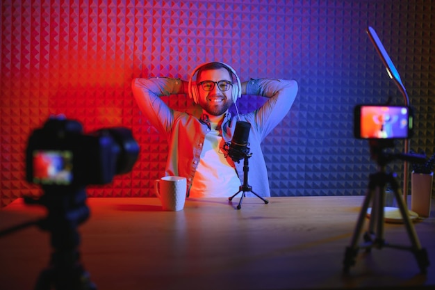 Young blogger recording video indoors