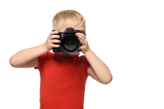 Young blond boy with camera