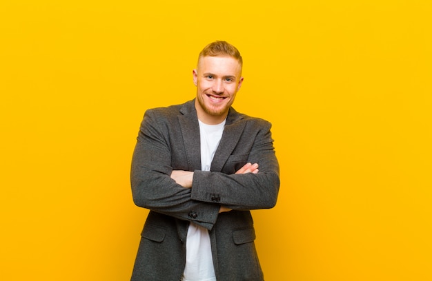 Young blond businessman feeling clueless and confused, having no idea, absolutely puzzled with a dumb or foolish look