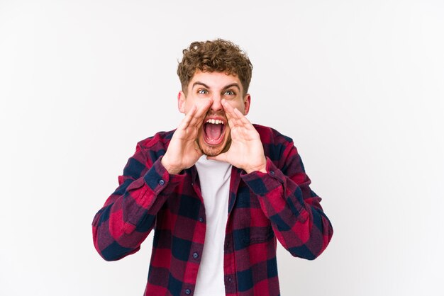 Photo young blond curly hair man shouting excited to front