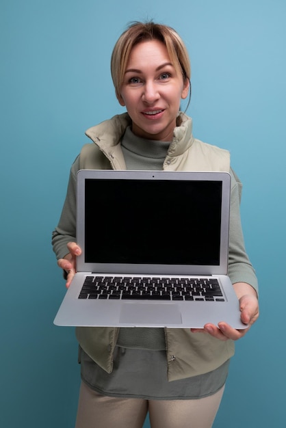 young blond hair woman showing laptop with mockup for advertising