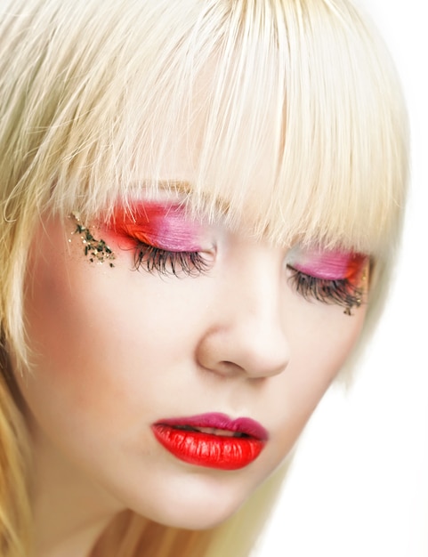 Young blond woman with bright make-up