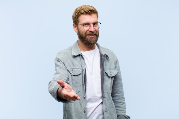 Young blonde adult man smiling