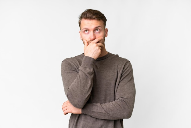 young blonde caucasian man over isolated background