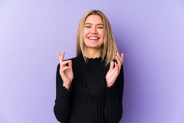 Young blonde caucasian woman isolated joyful laughing a lot. Happiness concept.