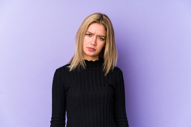 Young blonde caucasian woman isolated sad, serious face, feeling miserable and displeased.