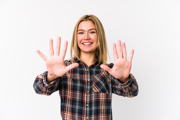 Young blonde caucasian woman isolated showing number ton with hands.