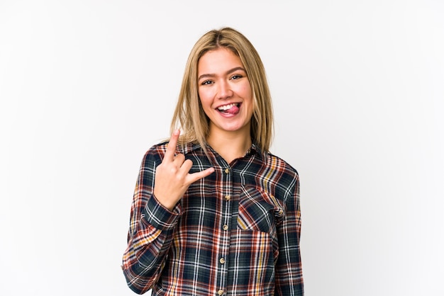 Young blonde caucasian woman isolated showing rock gesture with fingers