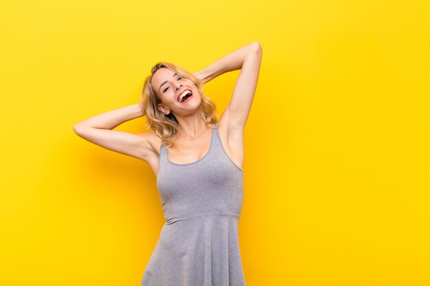 young blonde girl carefree laughing