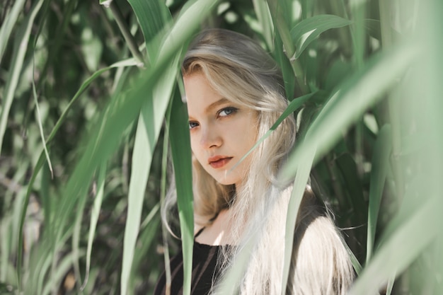 Young blonde girl in nature