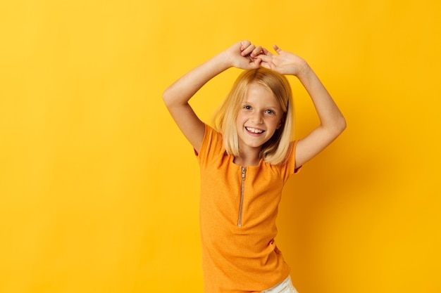 Young blonde girl smile hand gestures posing casual wear fun isolated background unaltered