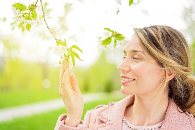 Young blonde lady enjoying spring time