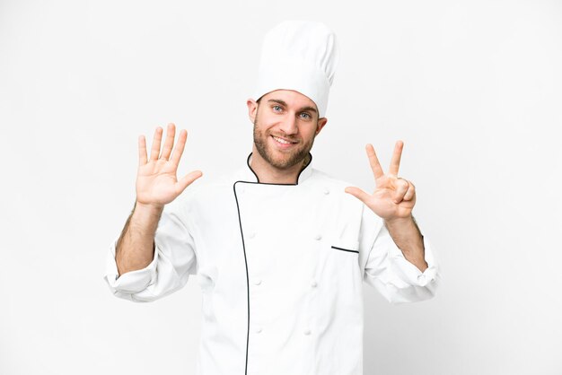 Young blonde man Chef over isolated white background counting eight with fingers