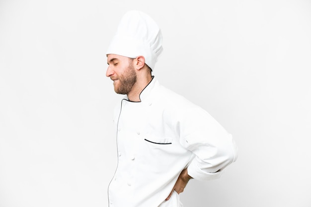 Young blonde man Chef over isolated white background suffering from backache for having made an effort