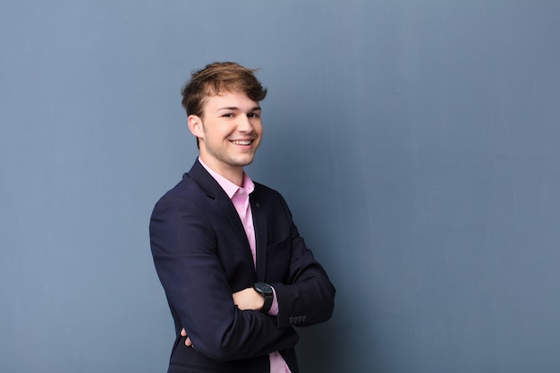 Young blonde man looking and smiling