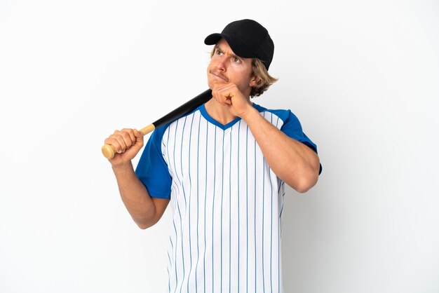 Young blonde man playing baseball isolated