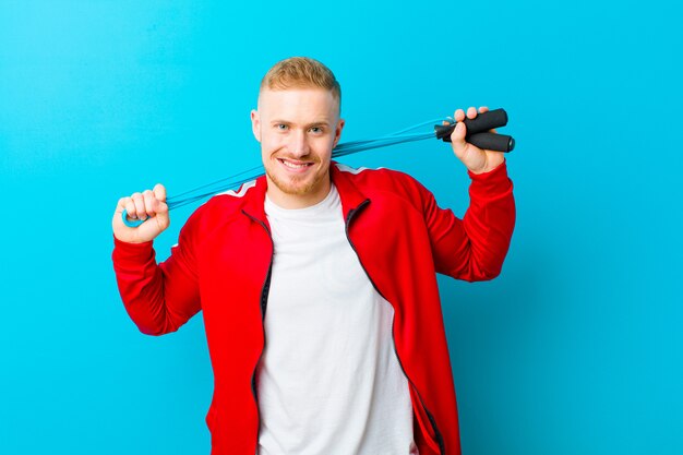 Young blonde man wearing sports clothes