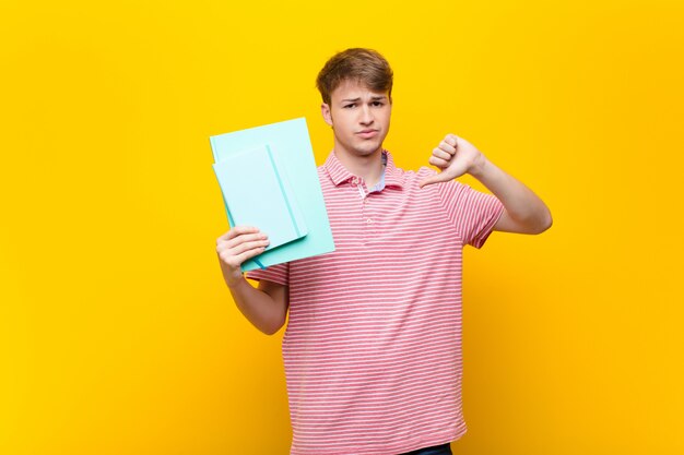 Young blonde man with book