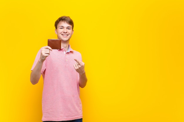 Young blonde man with a wallet