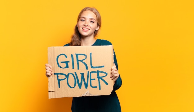 Photo young blonde woman. equality and girl power concept