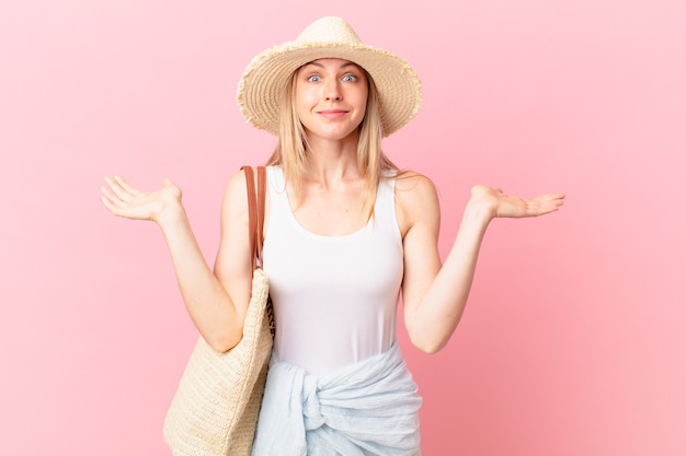 Young blonde woman feeling puzzled and confused and doubting