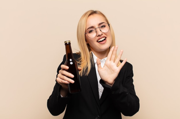 Young blonde woman feeling terrified, backing off and screaming in horror and panic, reacting to a nightmare